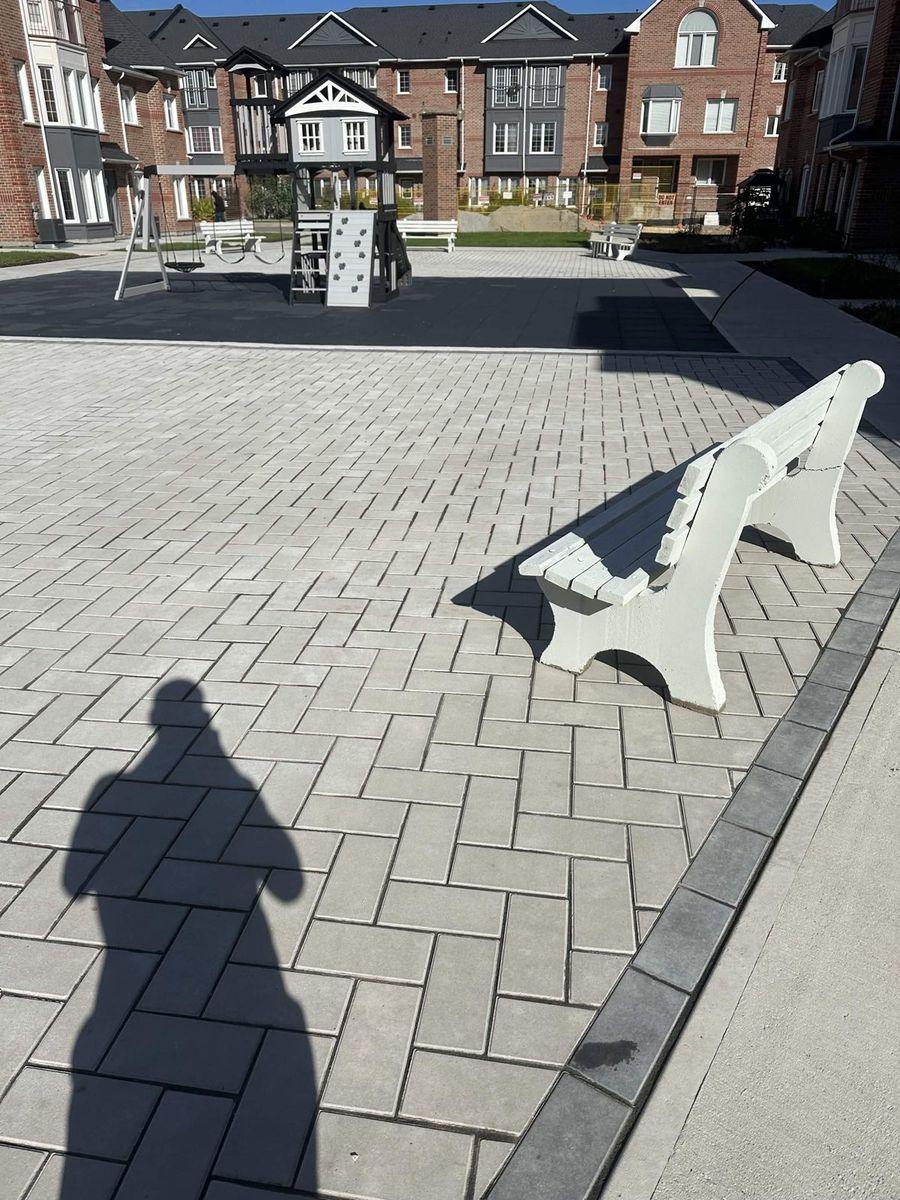 Herringbone interlock courtyard around the playground and benches