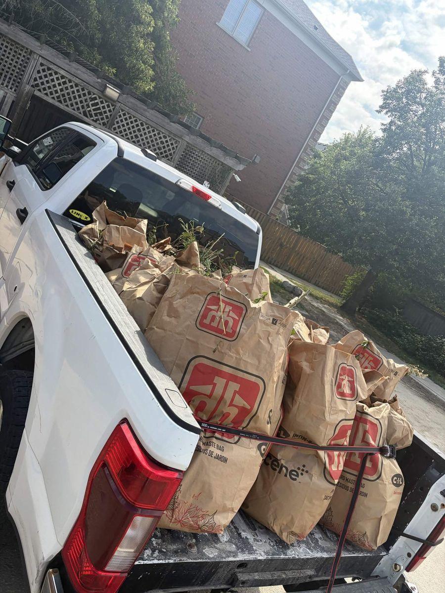 Truck loaded with yard waste bags