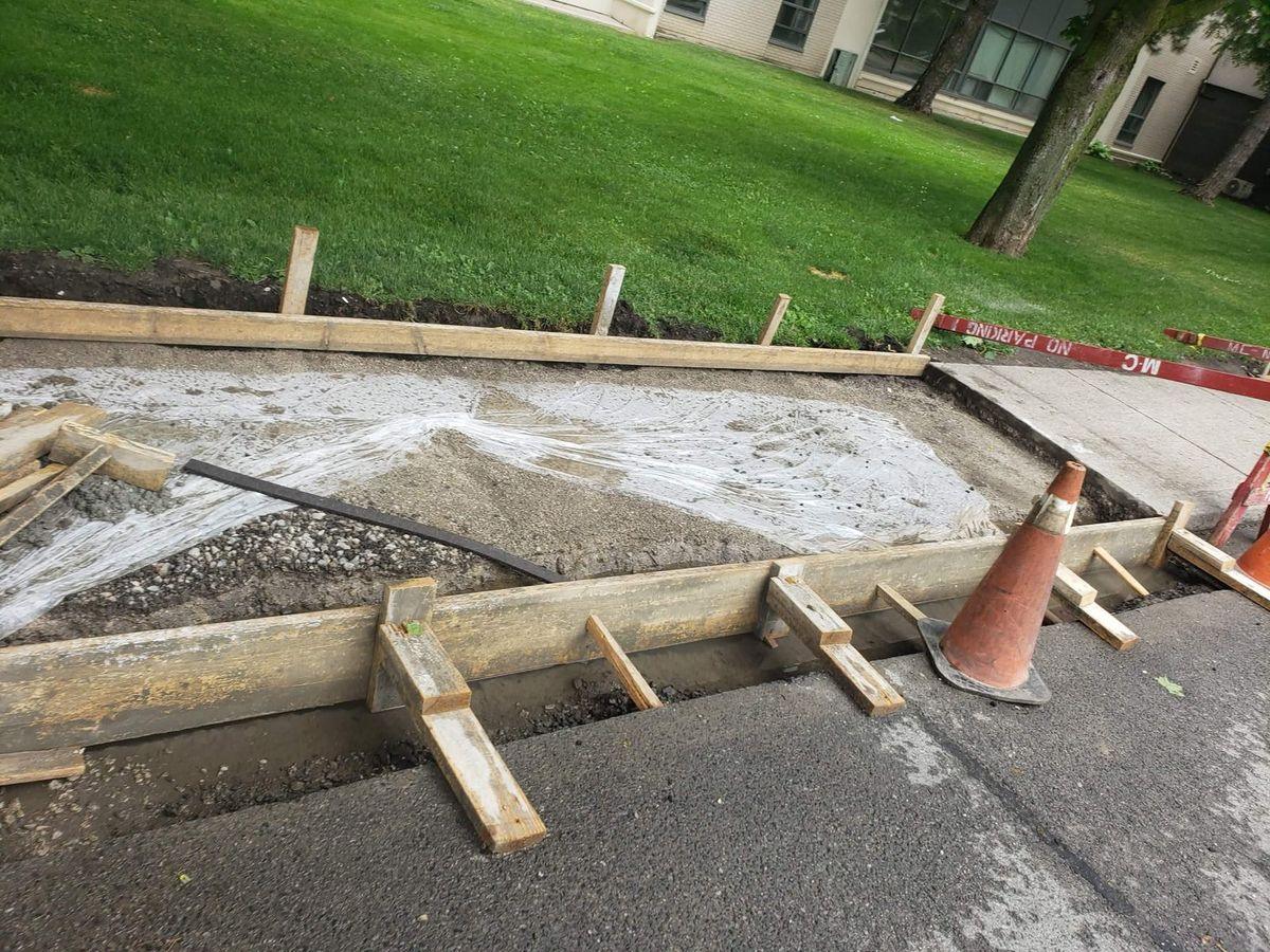 Timber forms staked along the new sidewalk, June 8, 2021