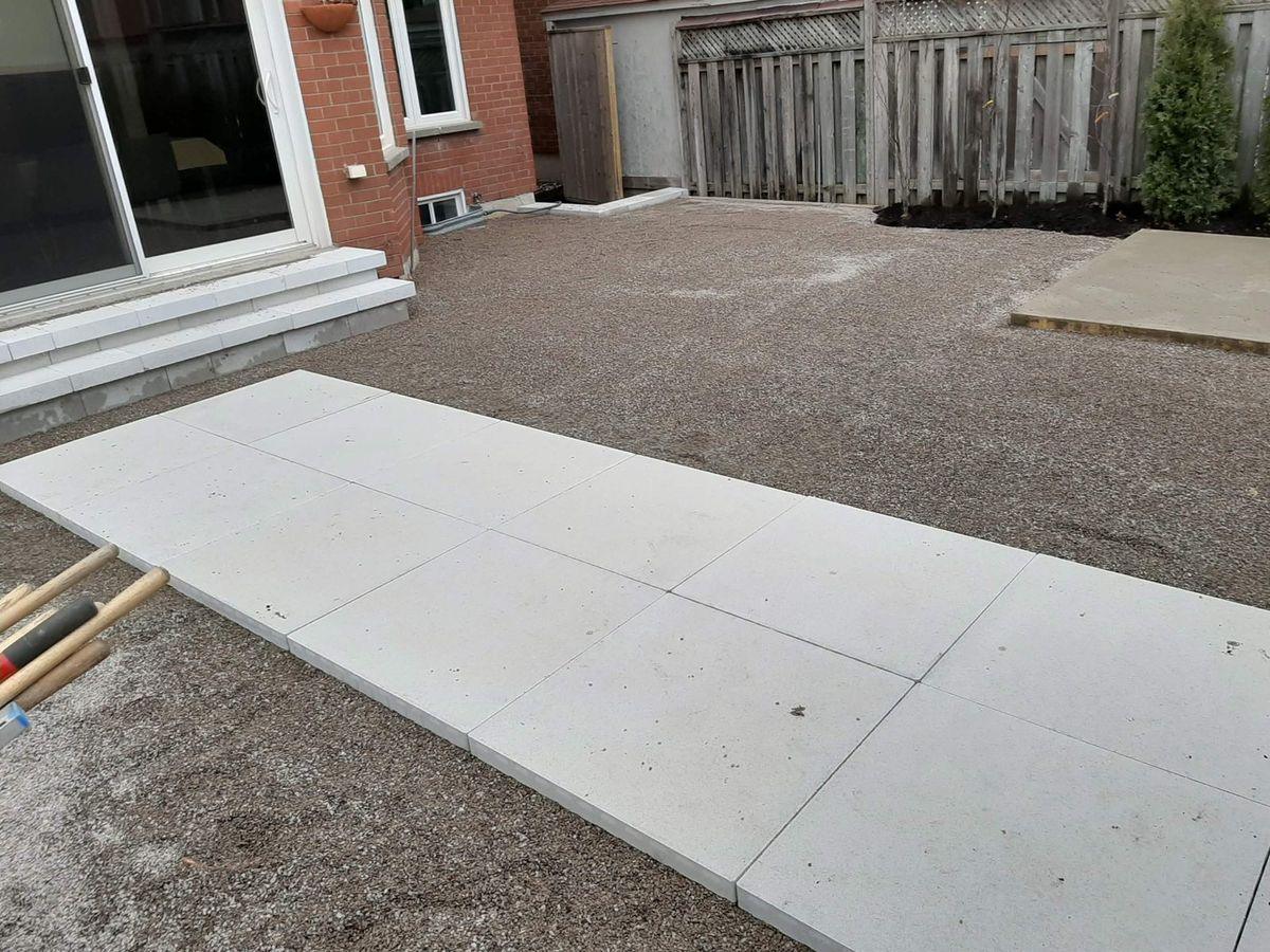 First large slabs set on the compacted gravel base, November 2020